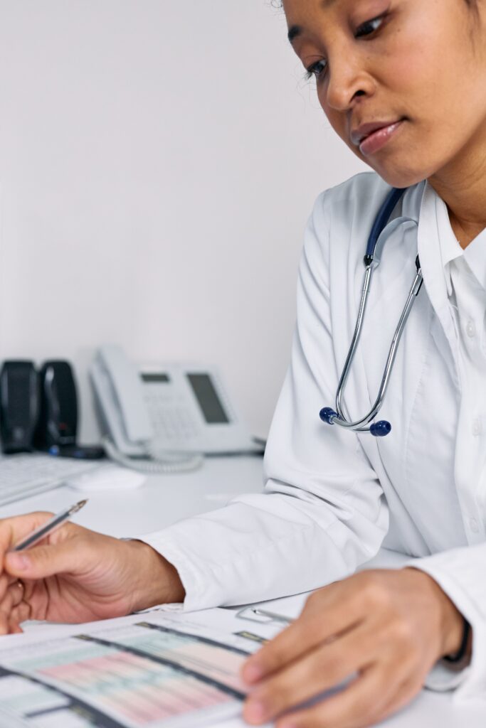 Hospital staff reviewing consent documents during insurance claim verification