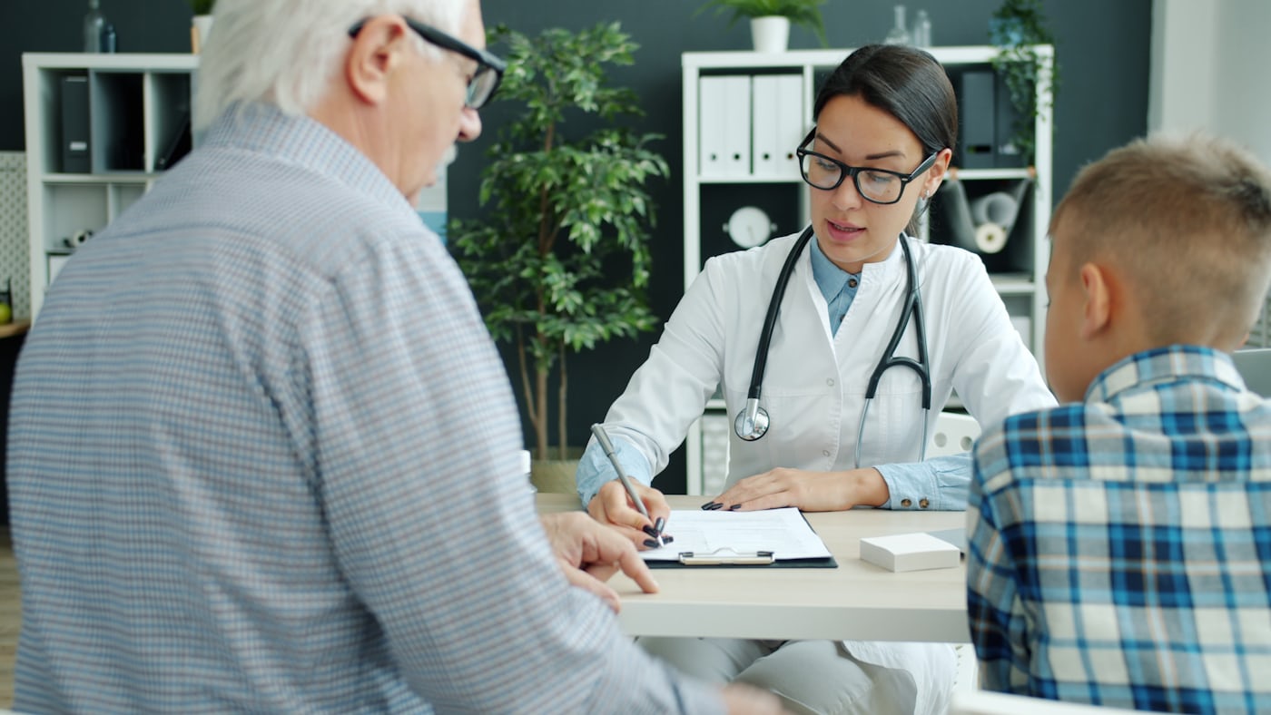 Hospital staff correcting admission and discharge date records for insurance claim