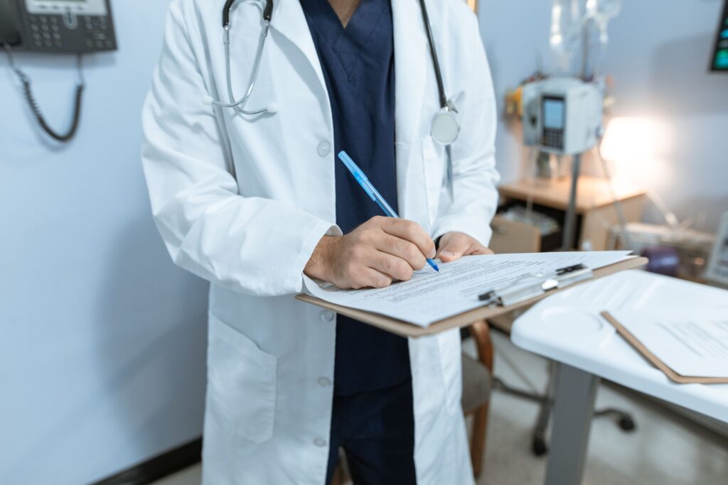 Hospital staff verifying operation theatre records for insurance claim review