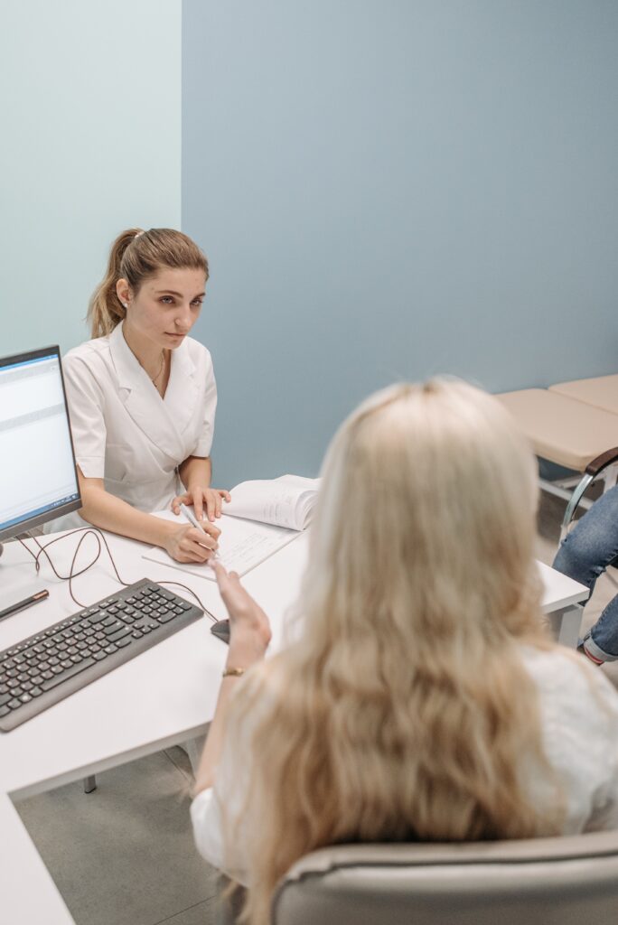 Patient discussing missing consent form with hospital records department