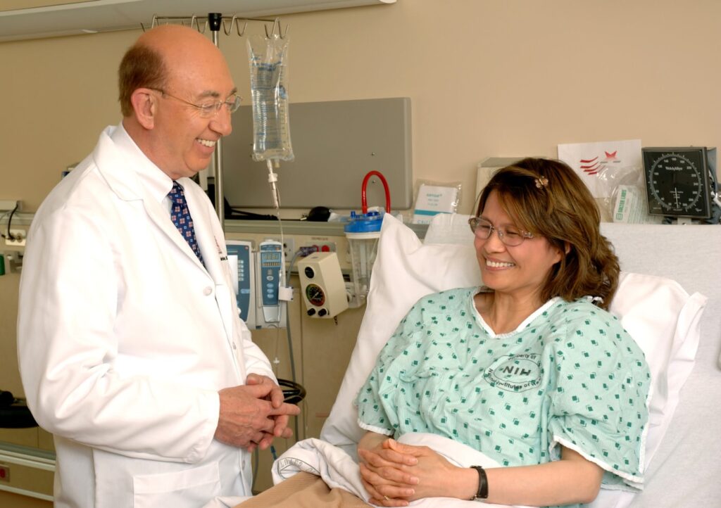 Patient discussing referral documents with healthcare provider