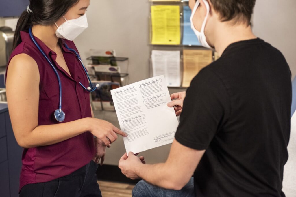 Hospital staff reviewing anesthesia records during health insurance claim verification
