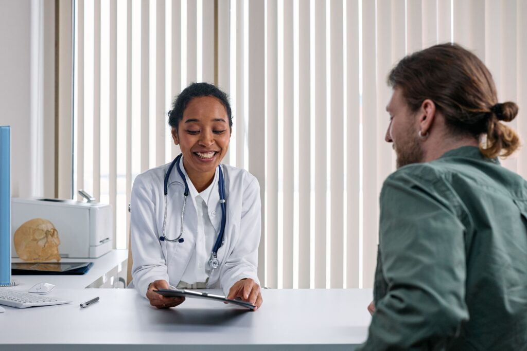 Hospital staff reviewing discharge summary during health insurance claim verification