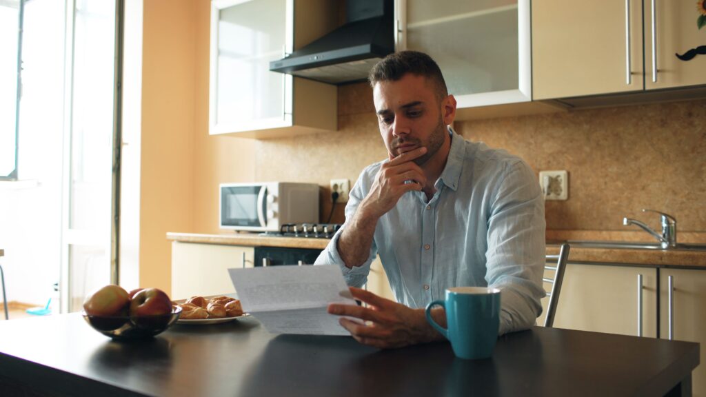 Policyholder reviewing health insurance claim closure letter